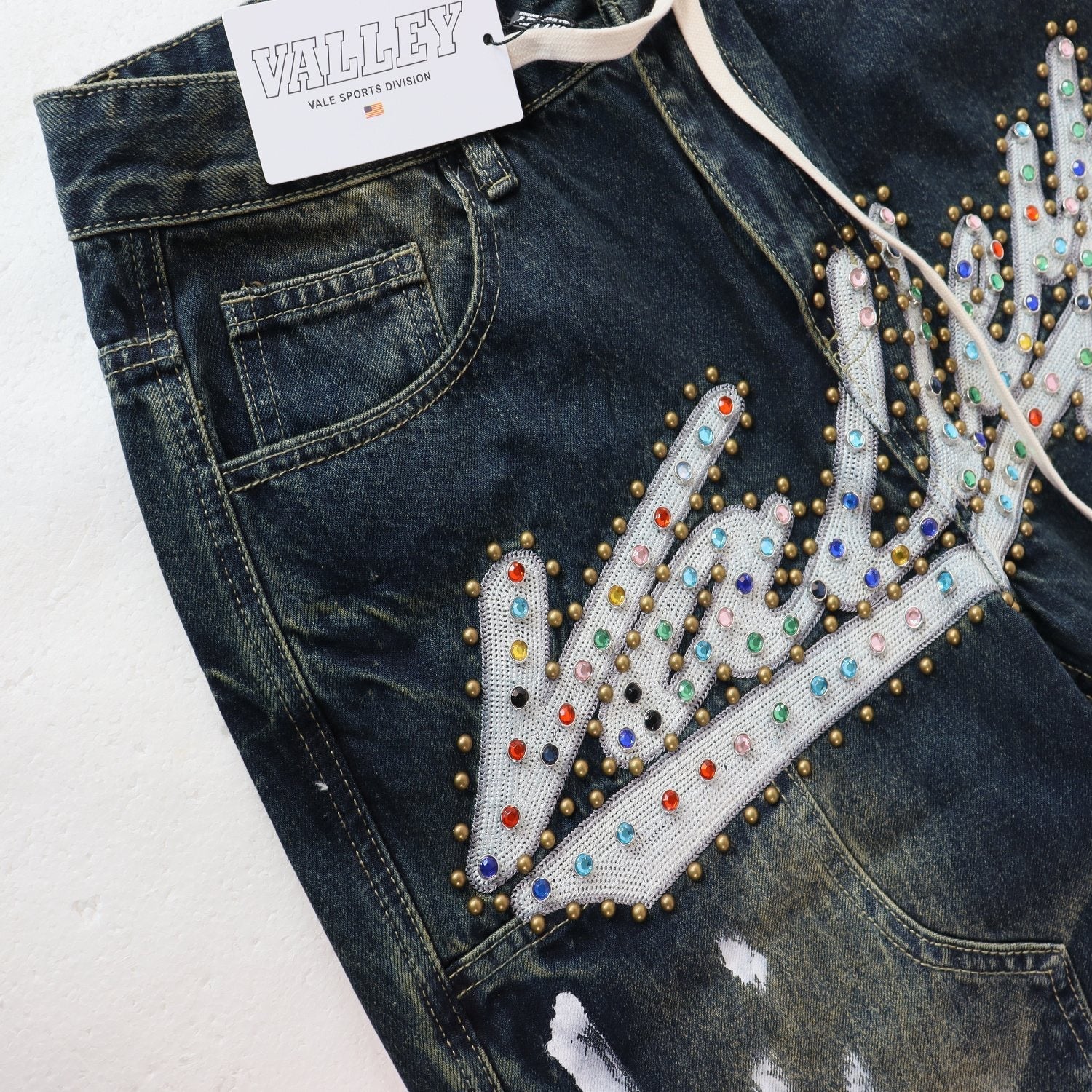 VALE Sports Division Embellished Wide-Leg Jeans — hang_tag