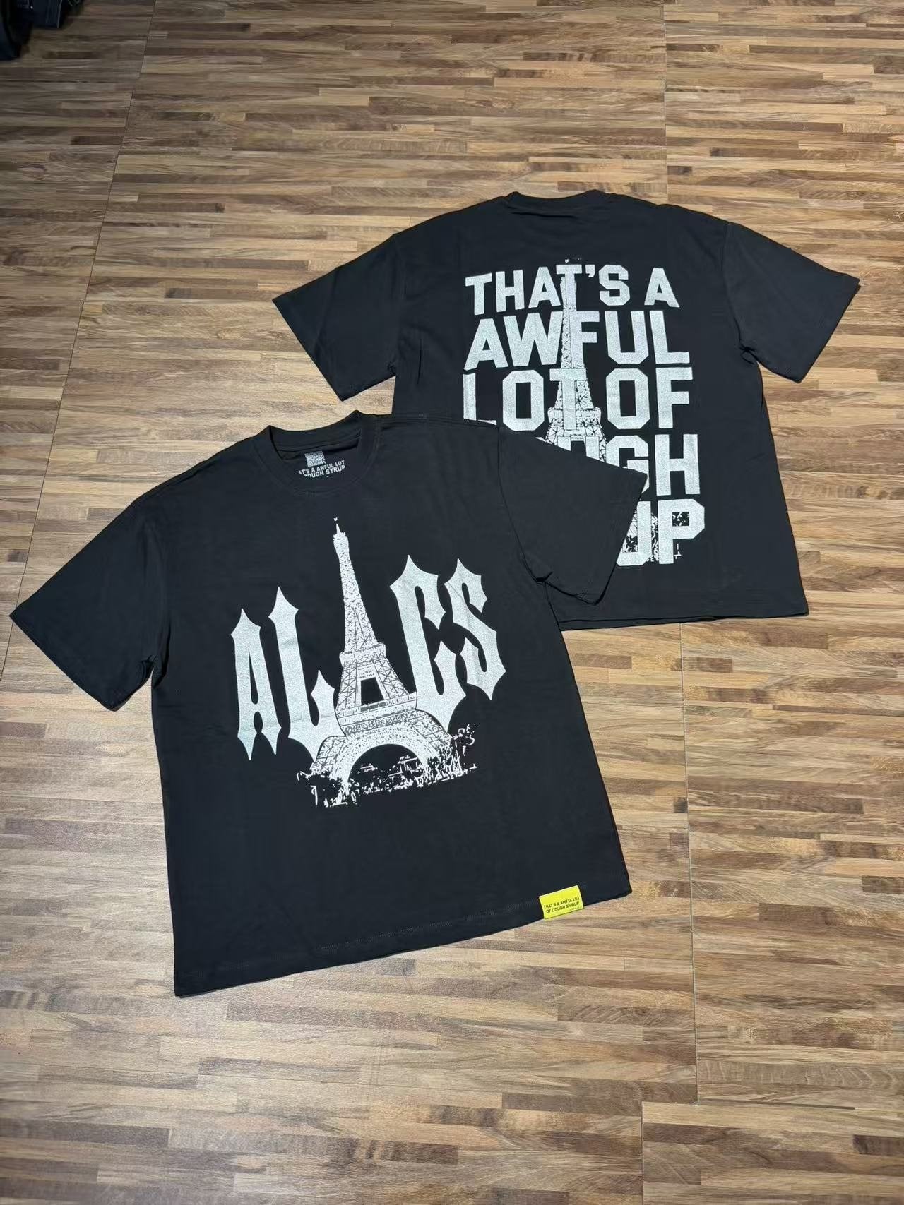 THAT'S A AWFUL LOT OF COUGH SYRUP Eiffel Tower Graphic T-Shirt — context