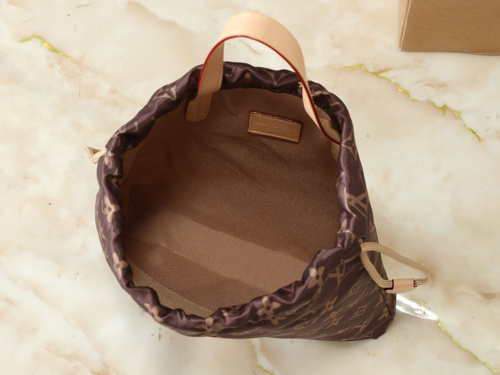 Louis Vuitton Keeper Monogram Drawstring Clutch — detail