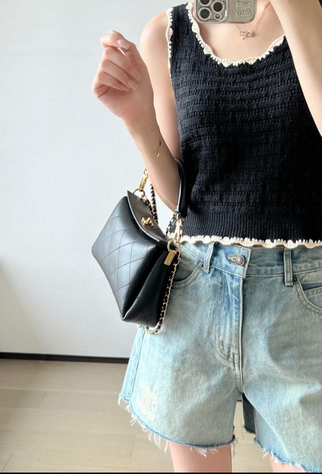 Chanel Black Diamond-Quilted Top Handle Bag — model