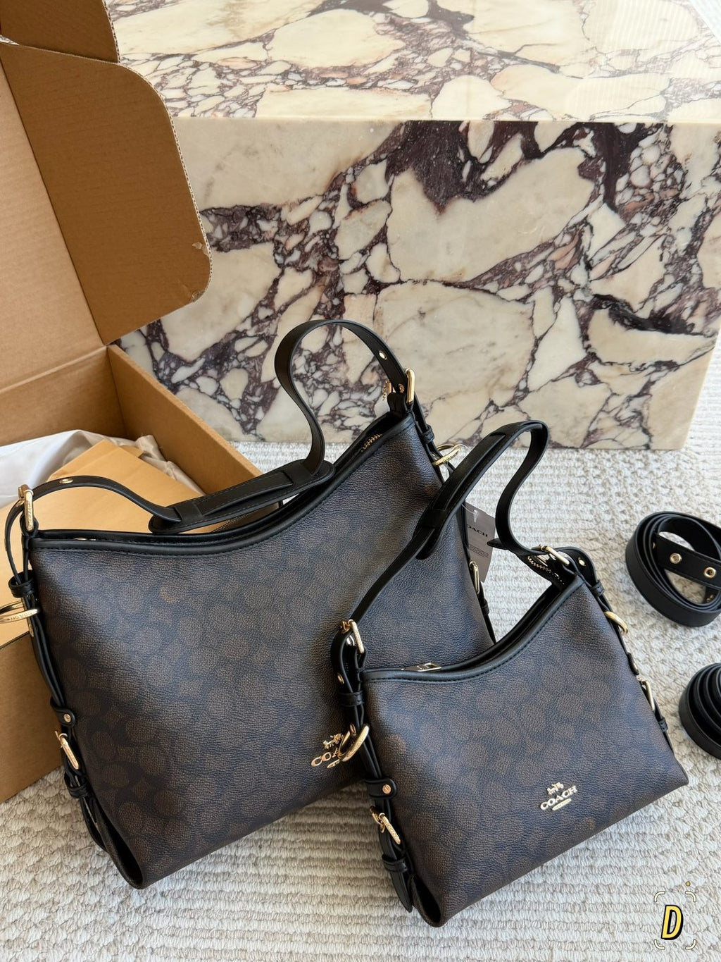 Coach Laurel Monogram Shoulder Bag — comparison