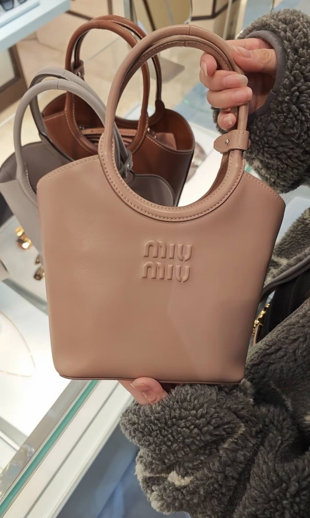 Miu Miu Ivy Circular-Handle Handbag — model