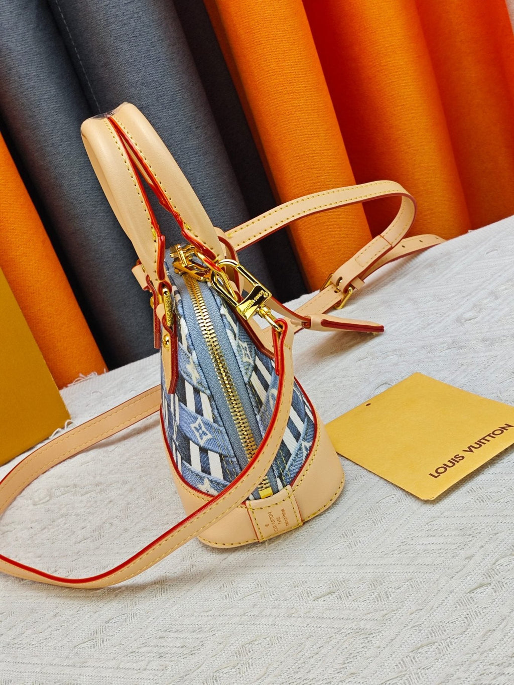 Louis Vuitton Alma BB Domed Top-Handle Bag — side