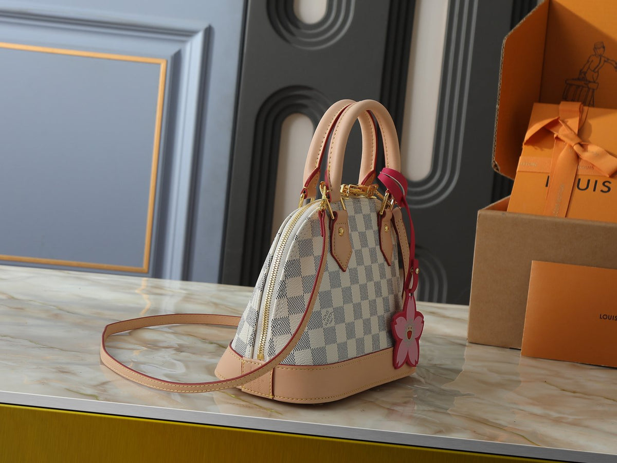 Louis Vuitton Alma Structured Top-Handle Bag — side