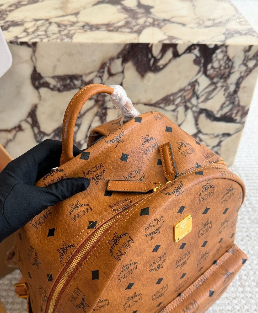 MCM Studded Monogram Backpack — detail