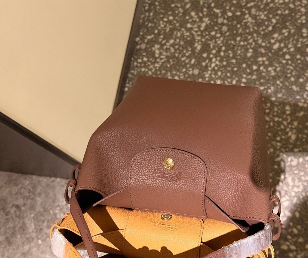 Longchamp Pebbled Leather Top-Handle Bucket Bag — detail