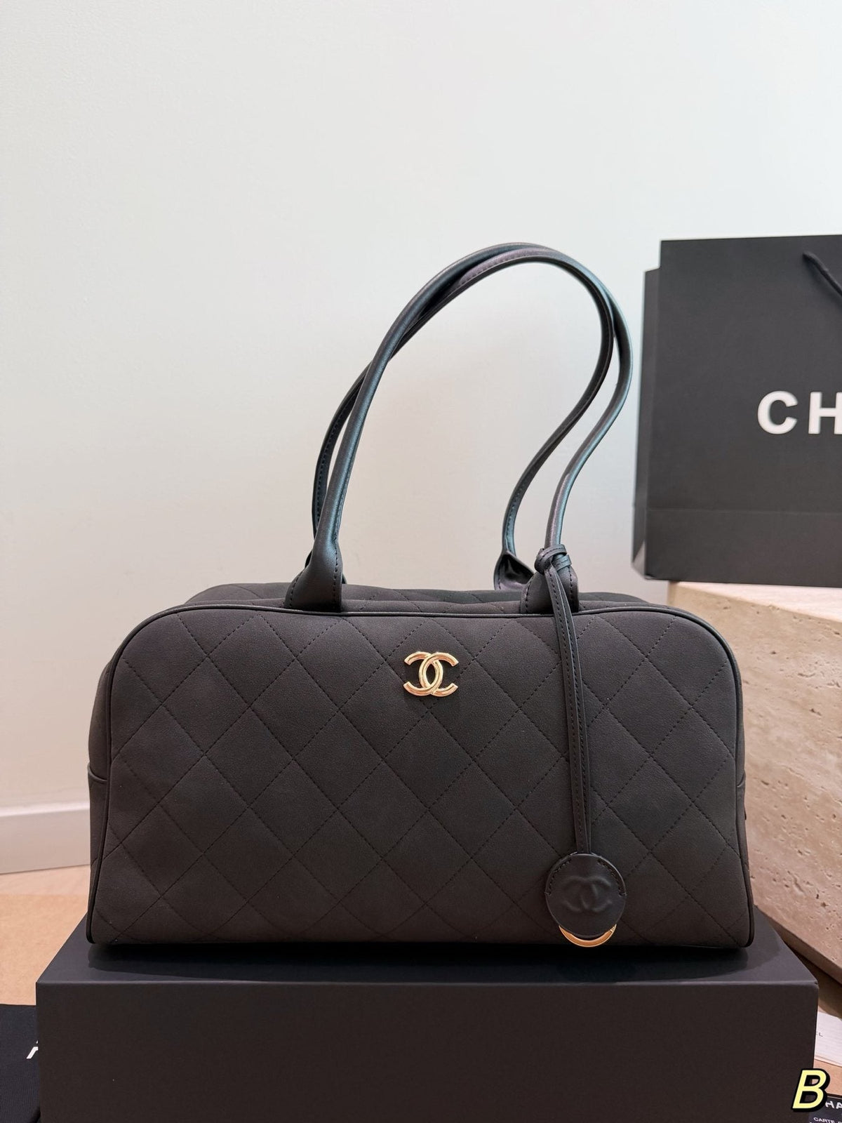 Chanel Diamond-Quilted Bowling Bag with Round Charm — front