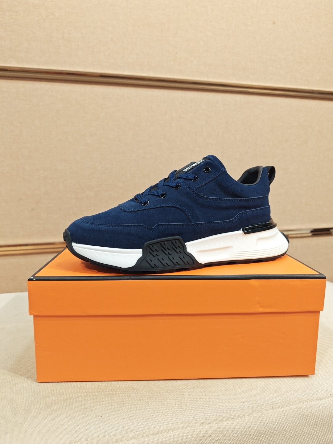 Hermès Lace-Up Sculpted-Sole Sneakers — front