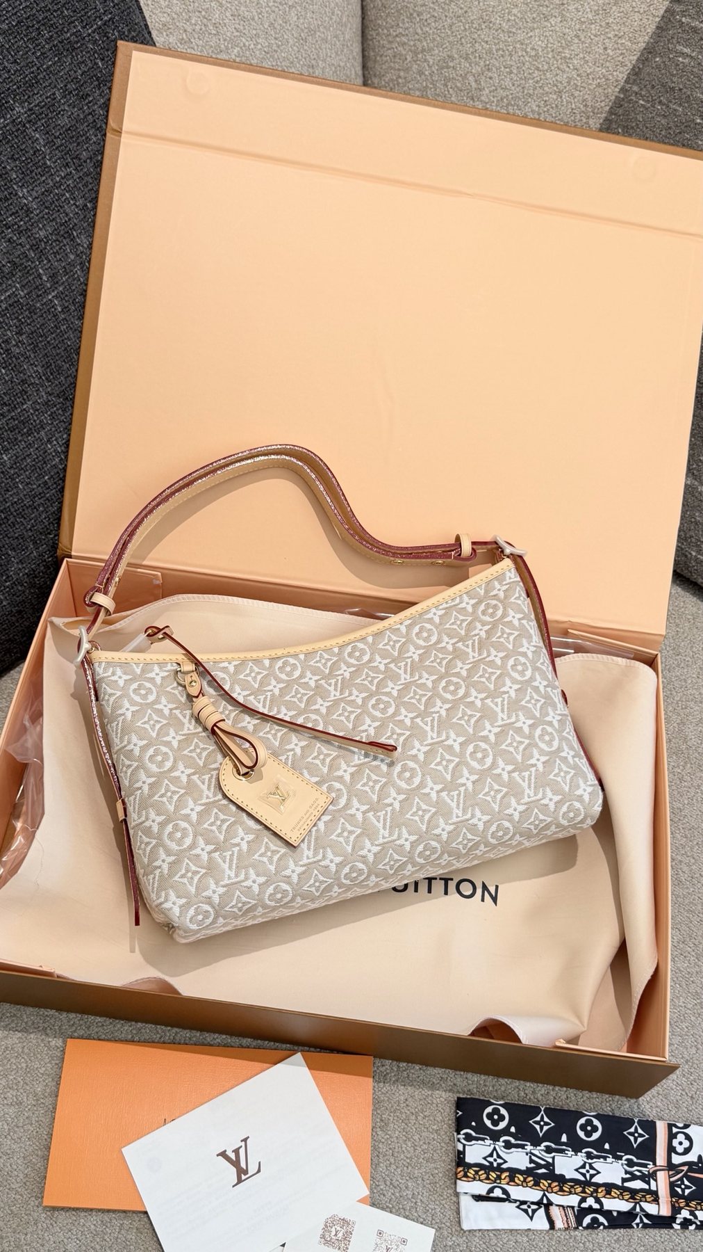 Louis Vuitton Carryall East West Raised Monogram Shoulder Bag — front
