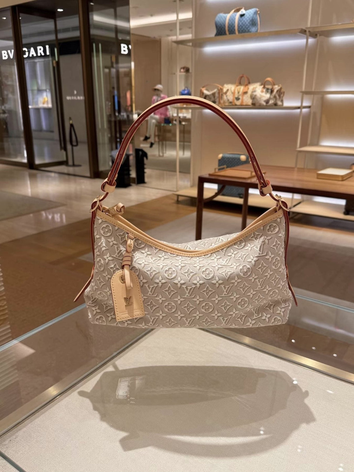 Louis Vuitton Carryall East West Raised Monogram Shoulder Bag — front