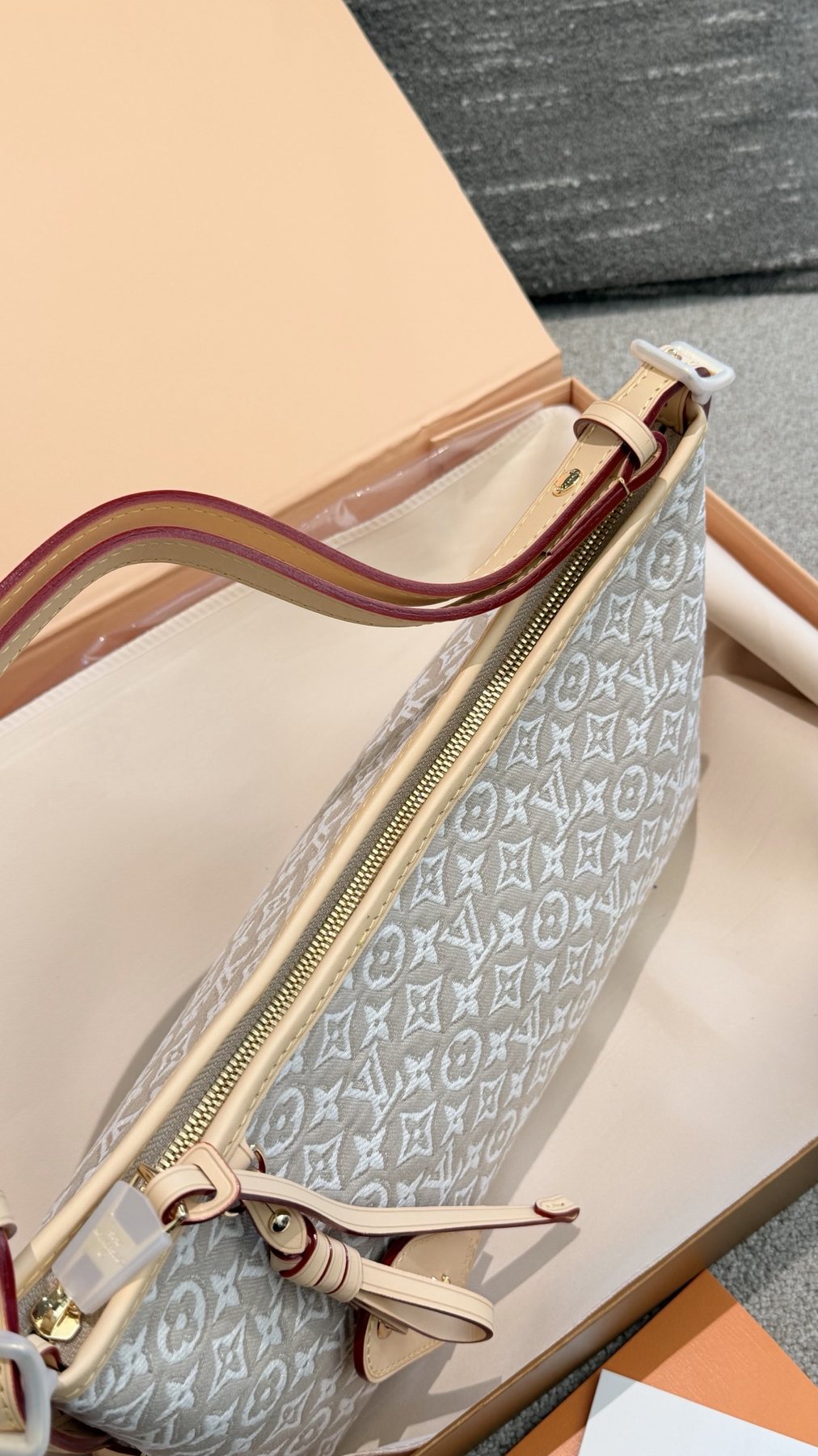 Louis Vuitton Carryall East West Raised Monogram Shoulder Bag — detail
