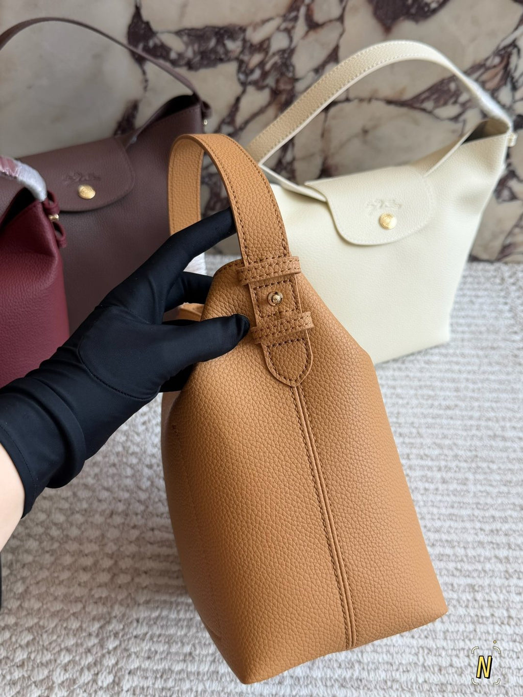 Longchamp Pebbled Bucket Bag with Rounded Snap Flap — side