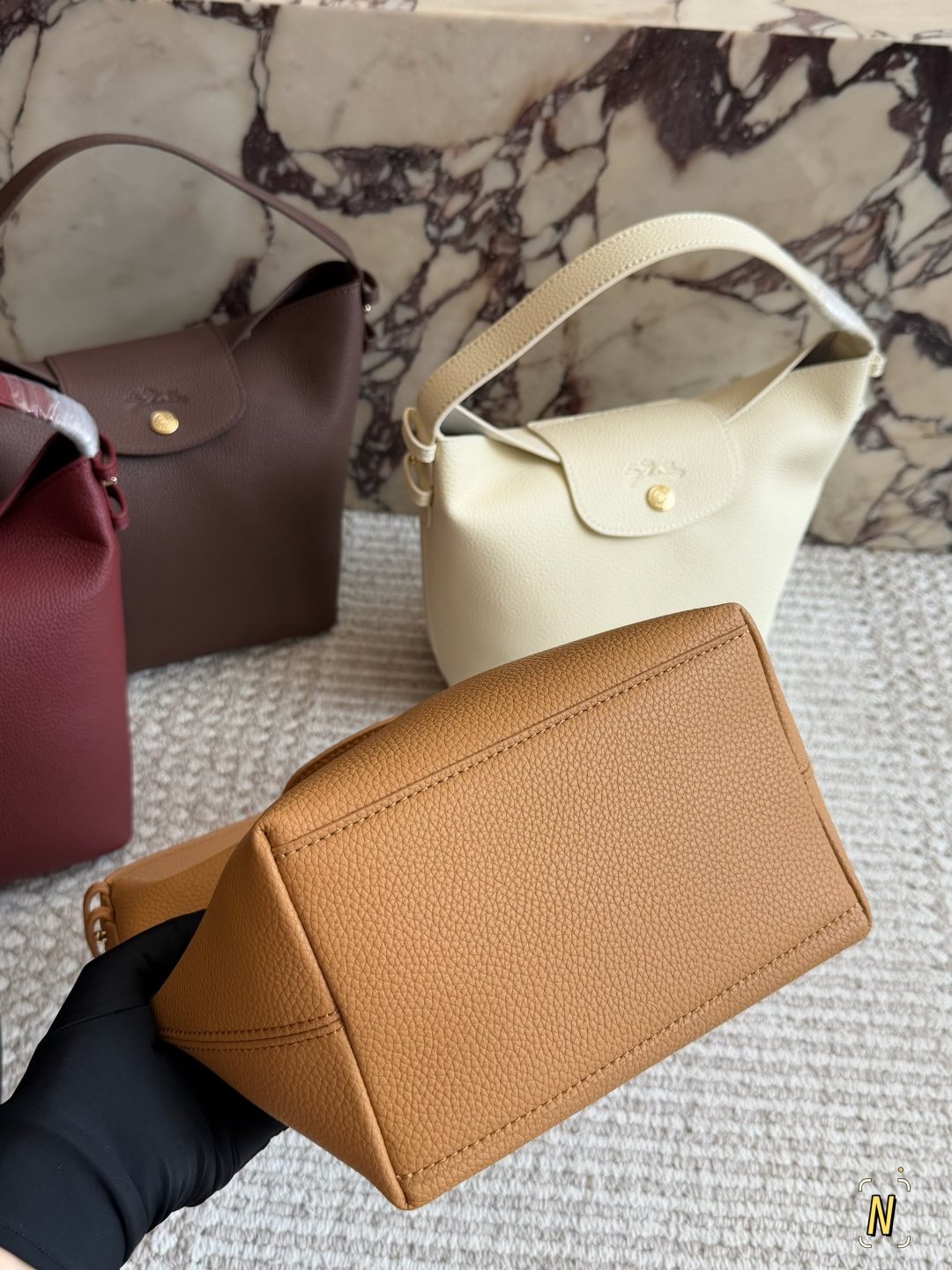 Longchamp Pebbled Bucket Bag with Rounded Snap Flap — detail