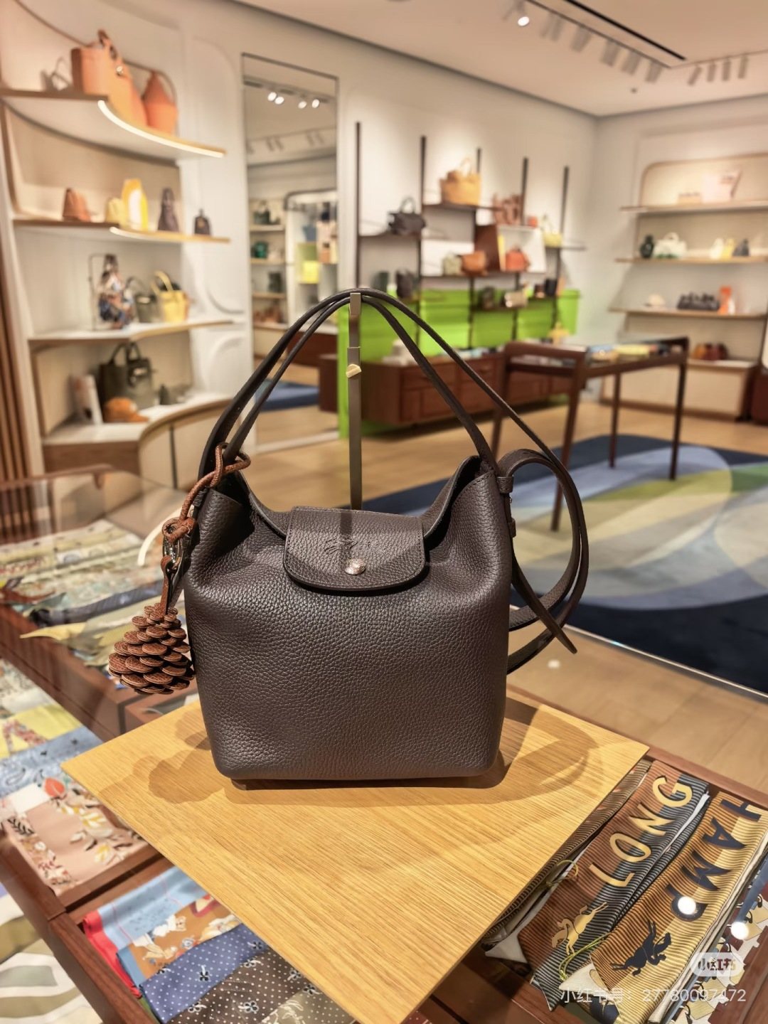 Longchamp Pebbled Bucket Bag with Rounded Snap Flap — hero