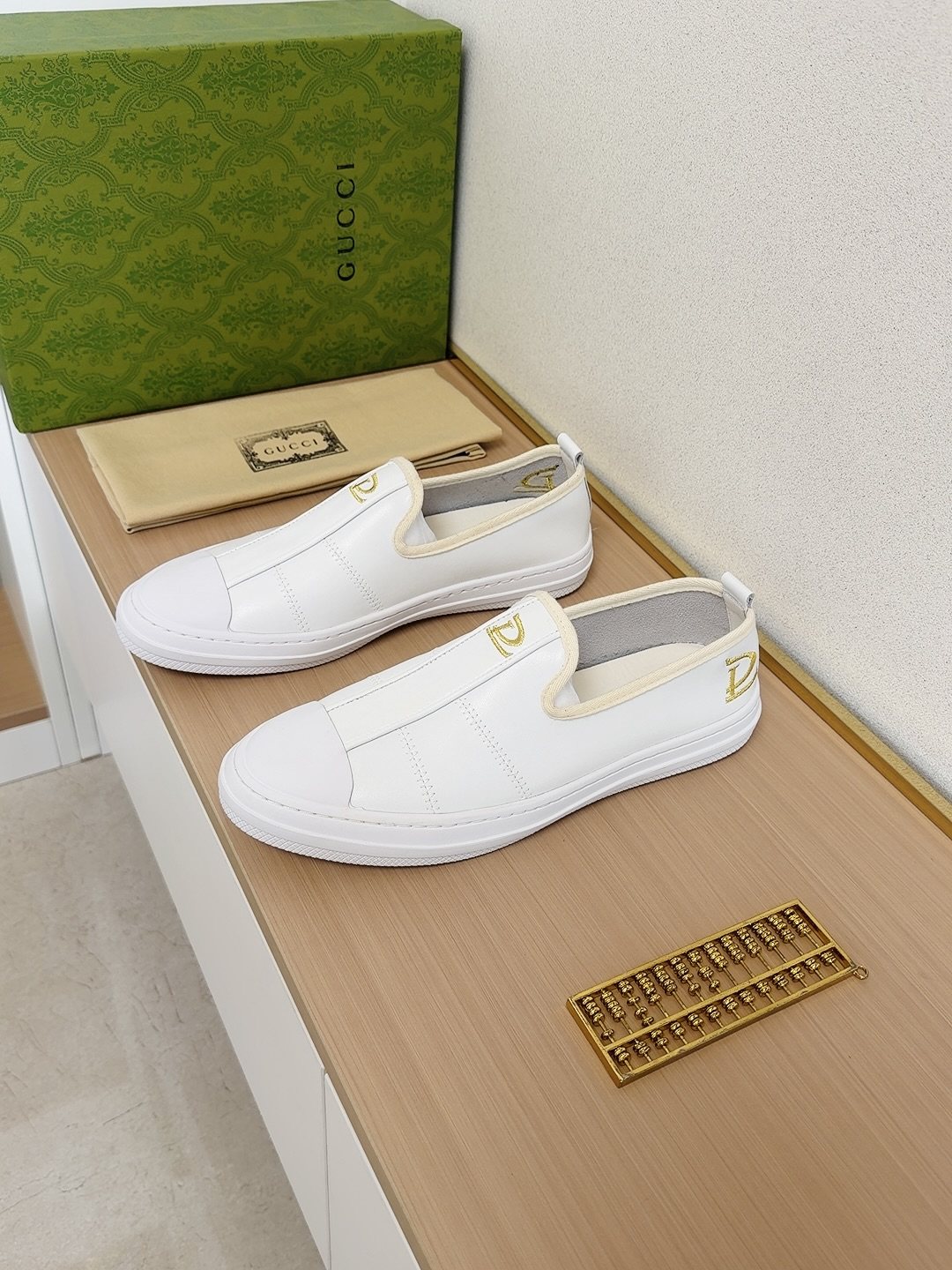 Gucci Brown Slip-On Sneakers with White Toe Caps — front