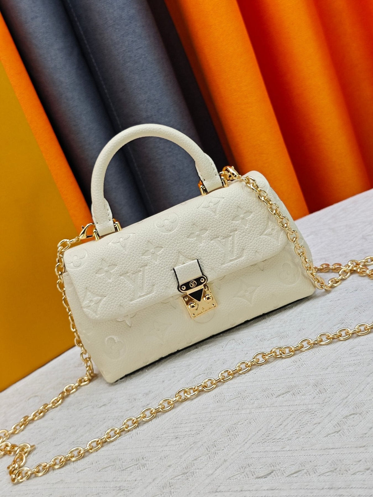 Louis Vuitton Nano Madeleine Monogram Empreinte Handbag — front