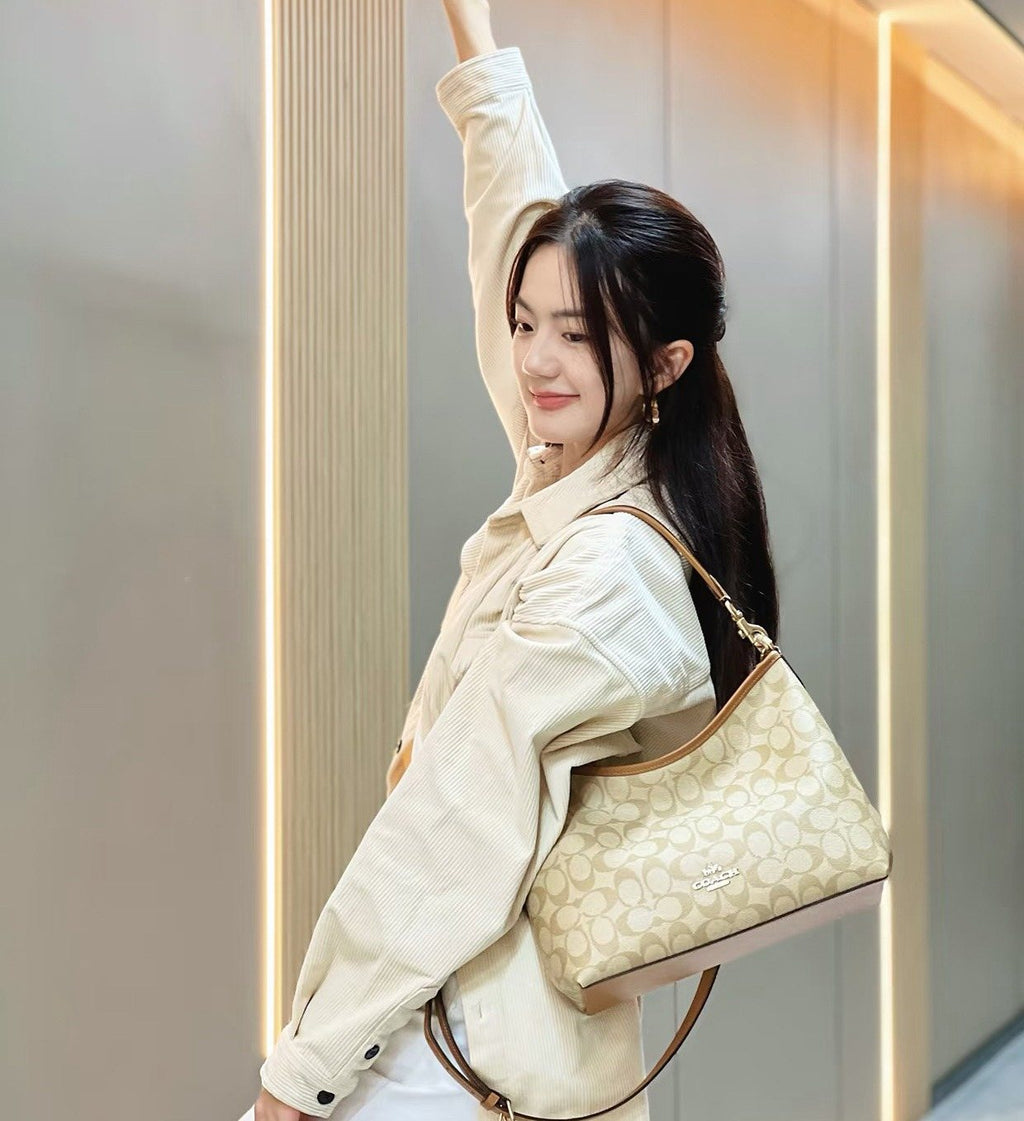 Coach Laurel Signature Print Hobo Bag — model