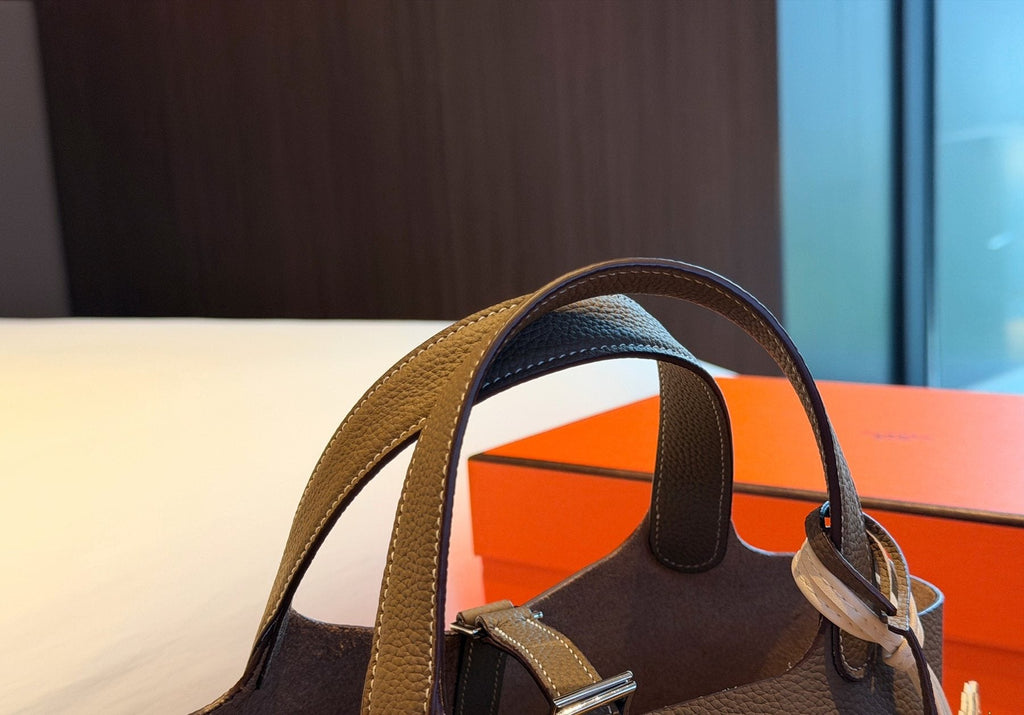 Hermès Curved-Panel Top-Handle Bucket Bag — detail