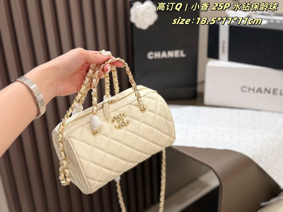 Chanel Quilted Bowling Bag with Jeweled CC Emblem — model