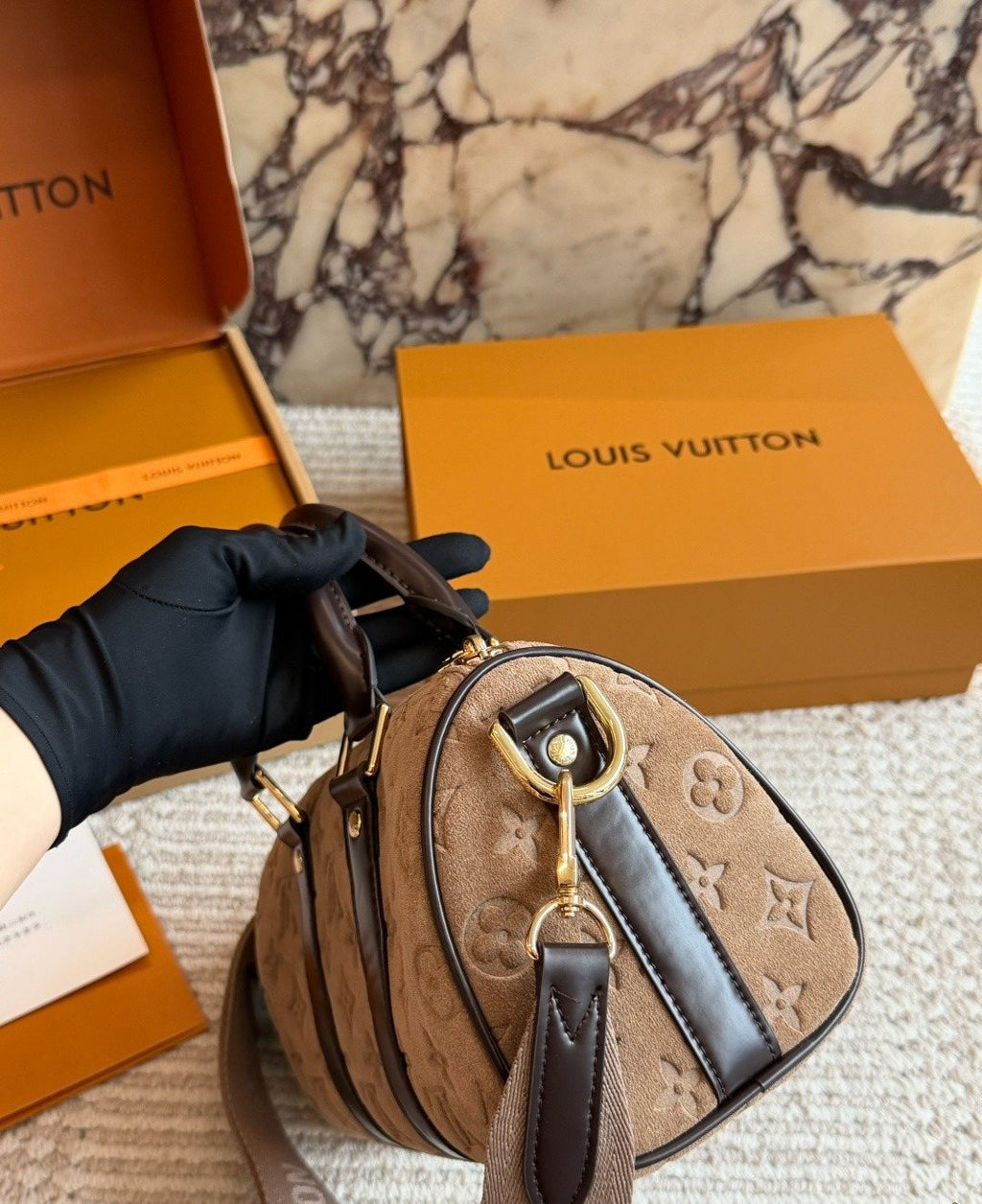 Louis Vuitton Keepall Embossed Monogram Duffel Bag — side