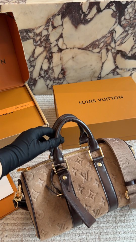Louis Vuitton Keepall Embossed Monogram Duffel Bag — model