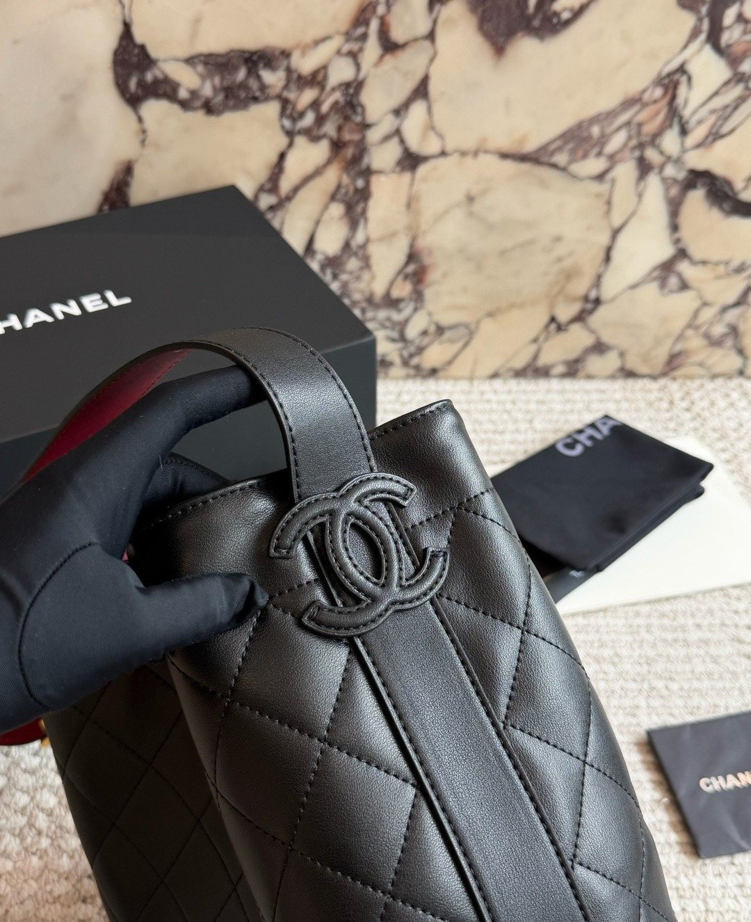 Chanel Diamond-Quilted Drawstring Bucket Bag — detail